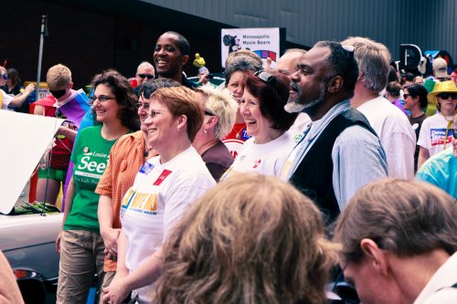 Rep. Erin Murphy, Sen. Mary Jo McGuire, and Sen. John Harrington pose for a picture at Twin Cities Pride.